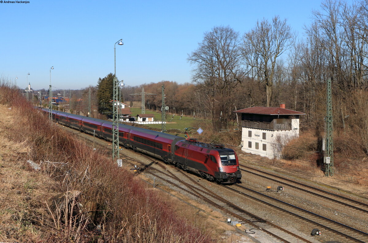 1116 203 mit dem RJX 160 (Bratislava hl.st. – Zürich HB) in Fischbach 12.2.22