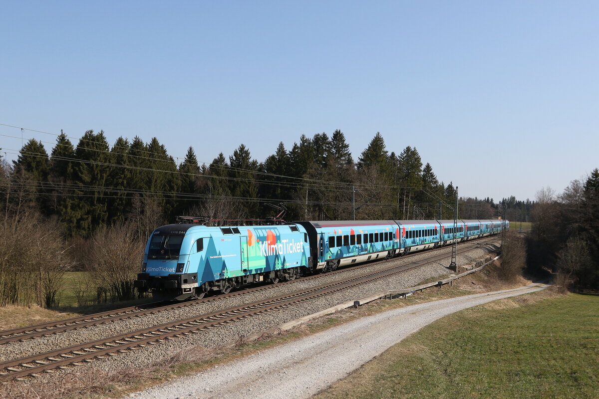 1116 244 mit dem  Klima-Railjet  aus Salzburg kommend am 25. März 2022 bei Übersee am Chiemsee.