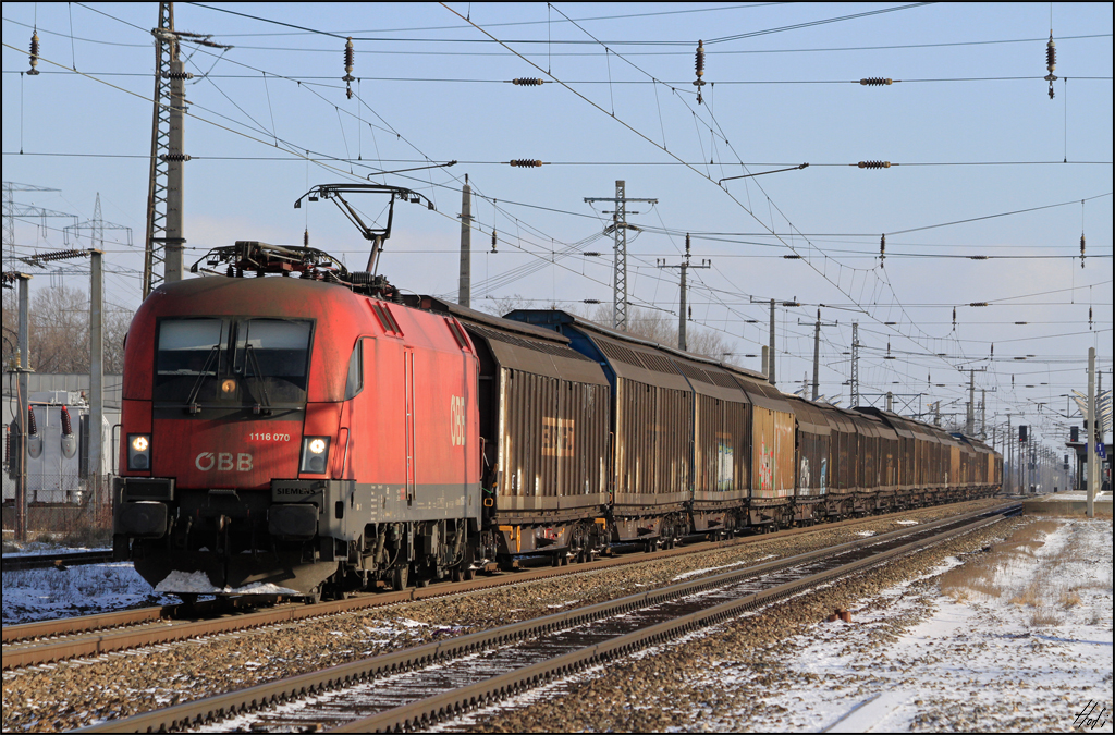 1116.070 fuhr am 30.12.14 mit Schiebewandwagenzug durch Götzendorf Ri. Gramatneusiedl.
