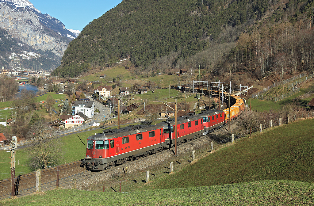 11293 departs Erstfeld whilst hauling a southbound freight train 20 Feb 2015