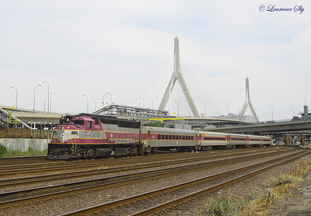 1138 passes the Leonard P. Zakim Bunker Hill Bridge whilst working train no 227, 1630 Boston North-Haverhill, 22 July 2013