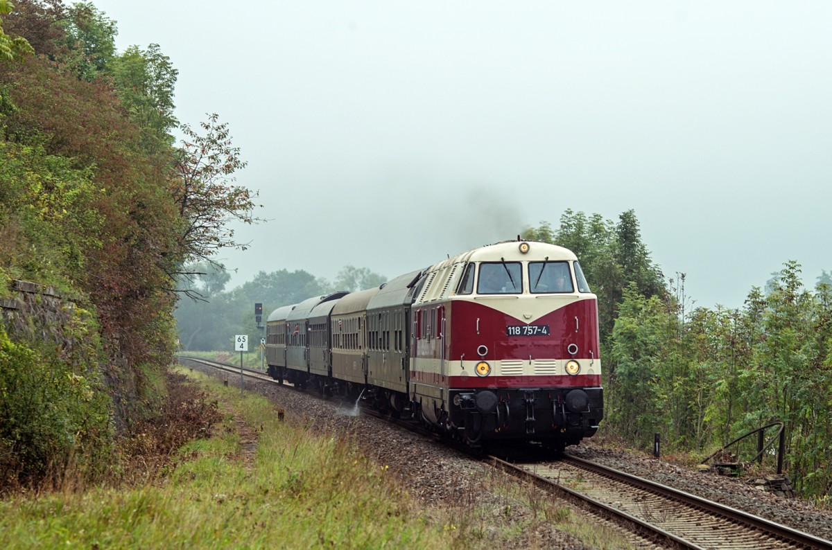 118 757 auf dem Weg nach Meiningen in den Morgenstunden des 06.09.2014, aufgenommen am Bahnhof Untermaßfeld.
German diesel locomotive class 118/228 hauled a special train on Saturday 06 September 2014 to Meiningen (GER). Photo was taken at train station  Untermaßfeld  in the early morning.