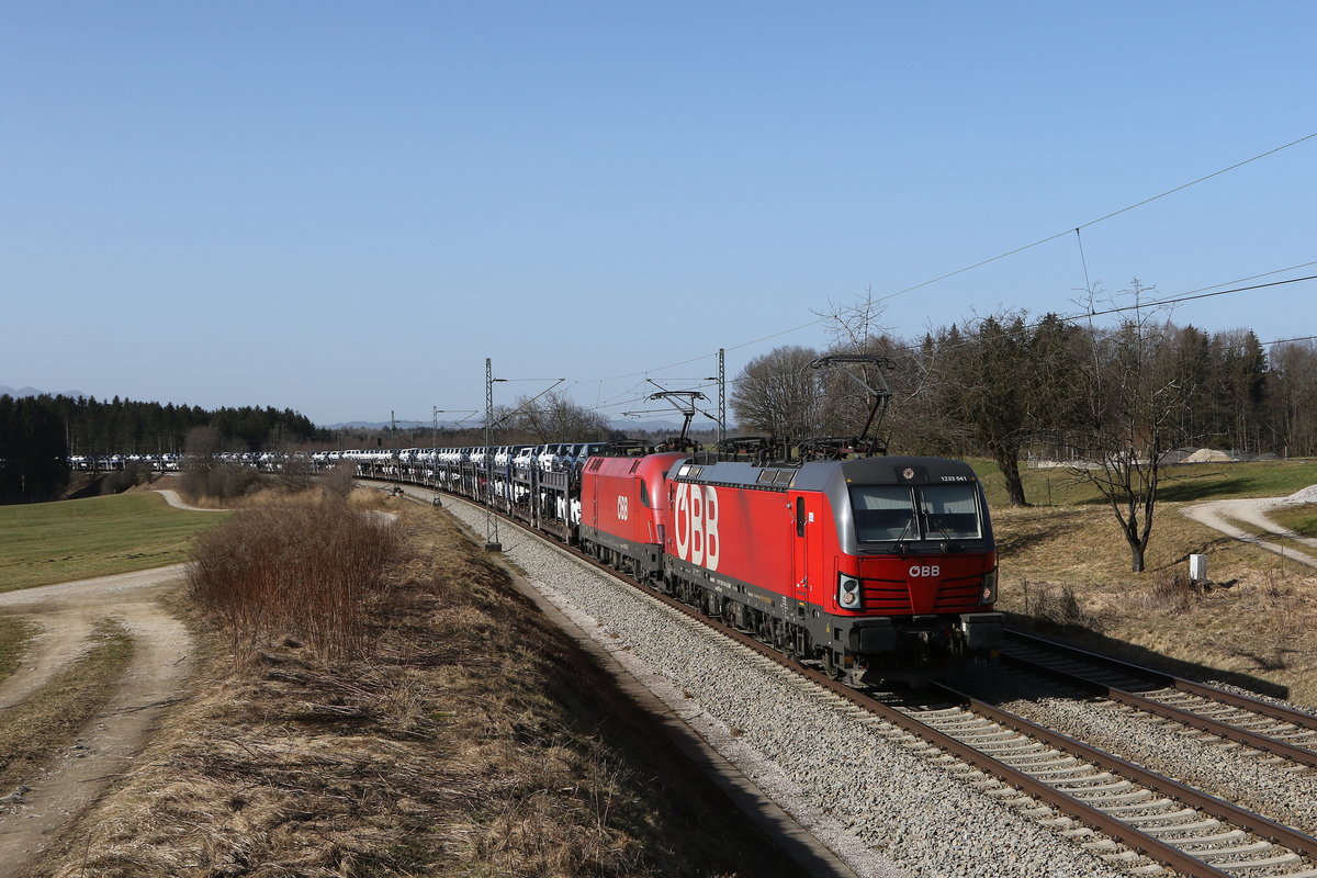 1293 041 & 1116 083 mit einem Autozug aus München kommend am 25. Februar 2021 bei Grabenstätt im Chiemgau.