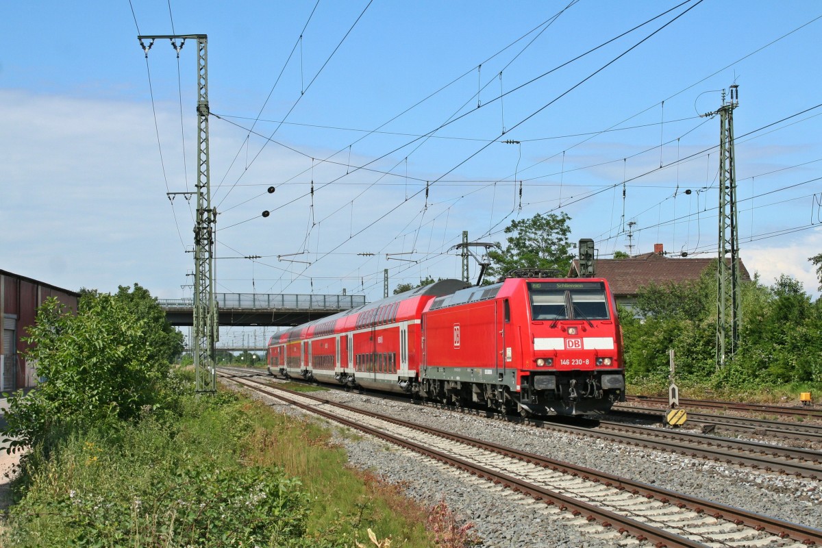 143 230-8 mit einem RE von Offenburg nach Schliengen am Nachmittag des 14.06.14 bei der Einfahrt in Mllheim (Baden).