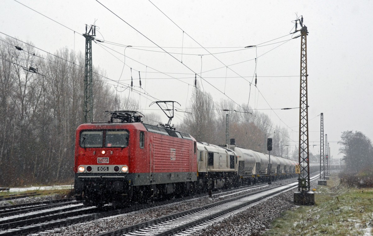 143 344 alias MEG 605 führte neben ihrem Leerzementzug nach Berlin auch 266 442 am 28.11.15 durch Leipzig-Thekla Richtung Mockau.