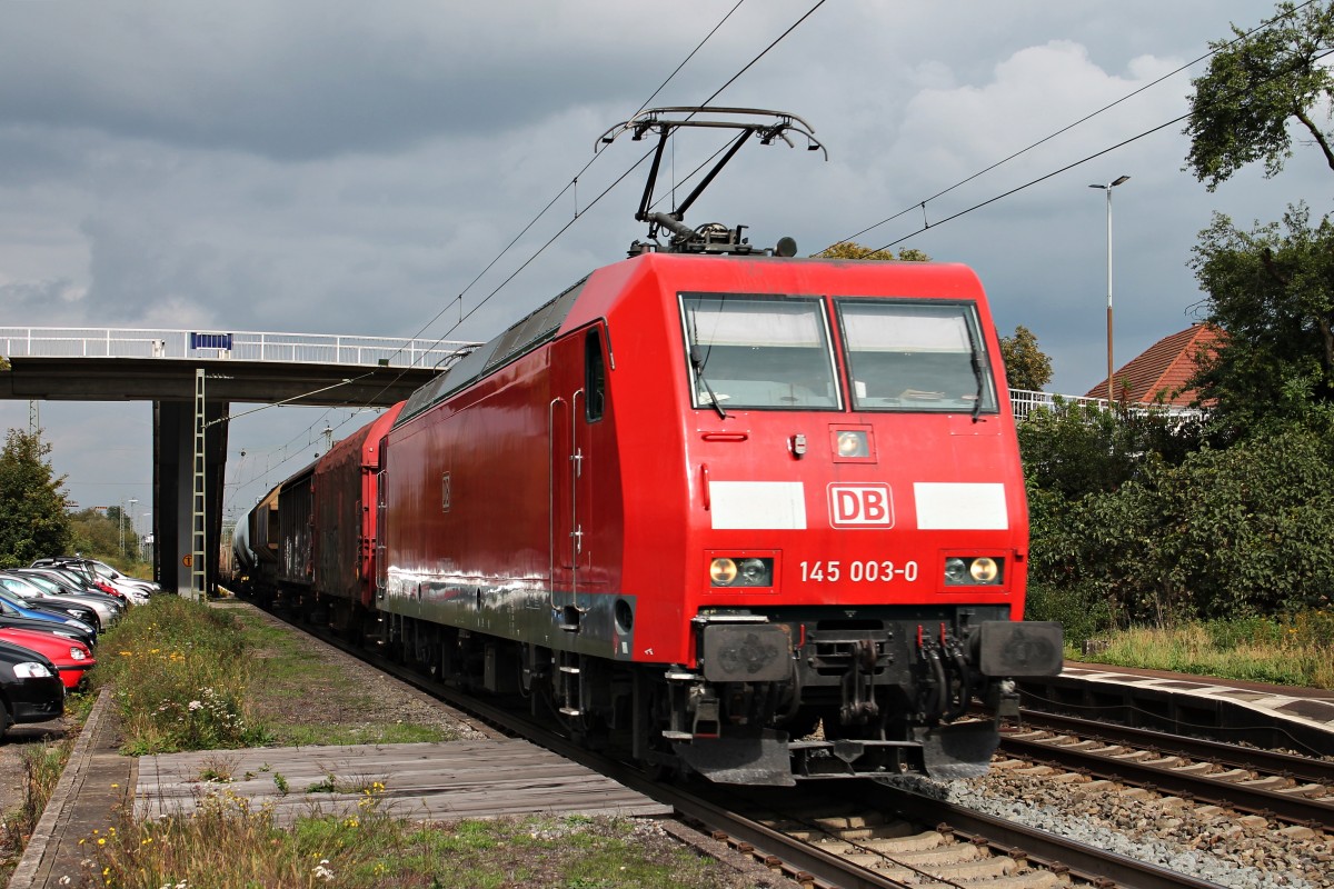 145 003-0 am 25.09.2014 mit einem gemischten Güterzug in Orschweier und fuhr in Richtung Süden/Schweiz.