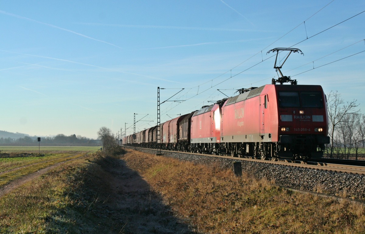 145 058-4 war zusammen mit 185 098-1 und einem Stahlzug am Morgen des 31.12.13 von Basel aus gen Norden unterwegs. Hier konnte ich den Zug bei H�gelheim festhalten.
