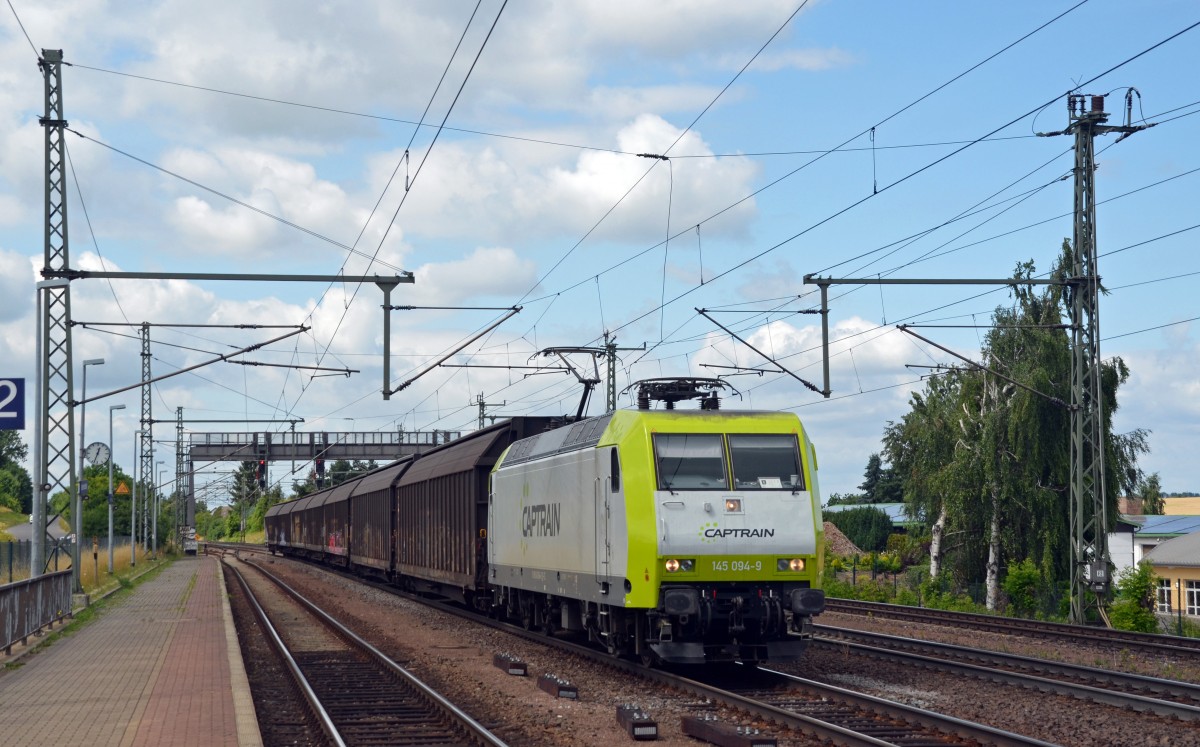 145 094 zog am 10.07.15 einen Autologistiker durch Niederndodeleben Richtung Magdeburg. Ziel ist das Porschewerk in Leipzig-Wahren.