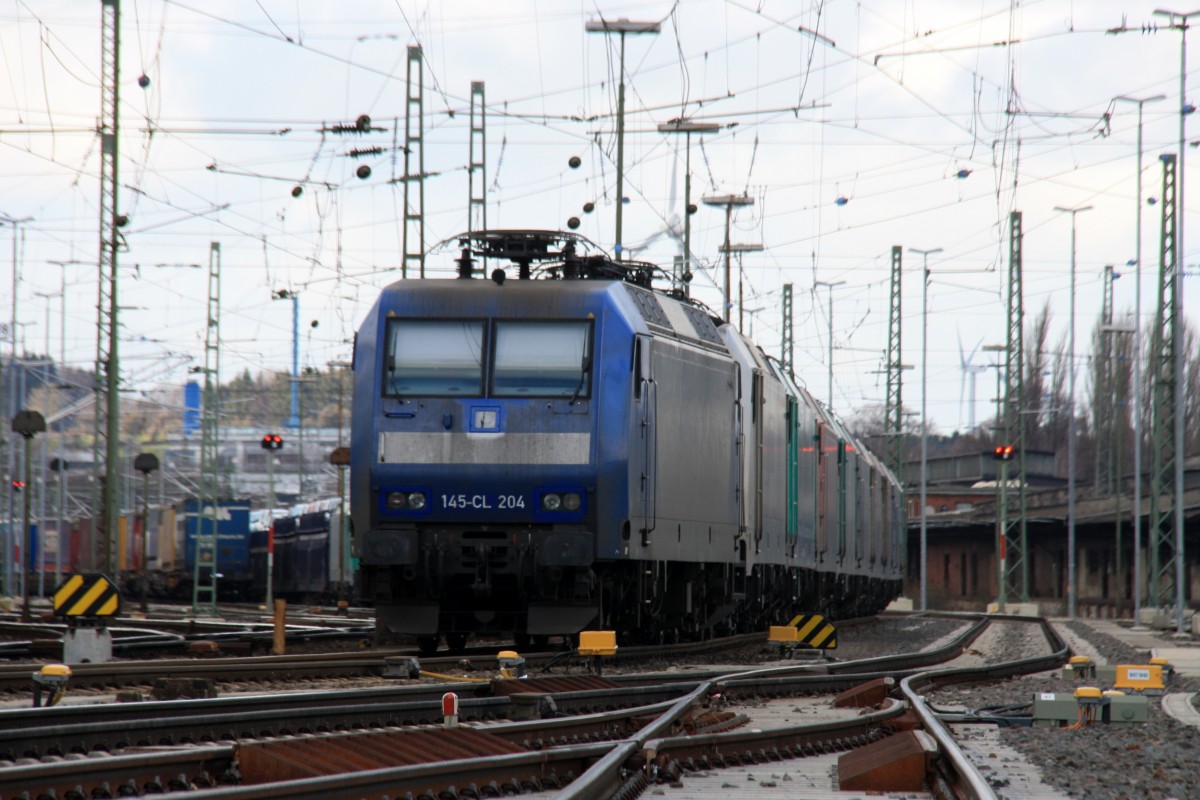 145 CL-204 von Crossrail steht mit 8 E-Loks von Crossrail stehen auf dem abstellgleis in Aachen-West bei Sonne und Regenwolken am Nachmittag vom 16.2.2014.