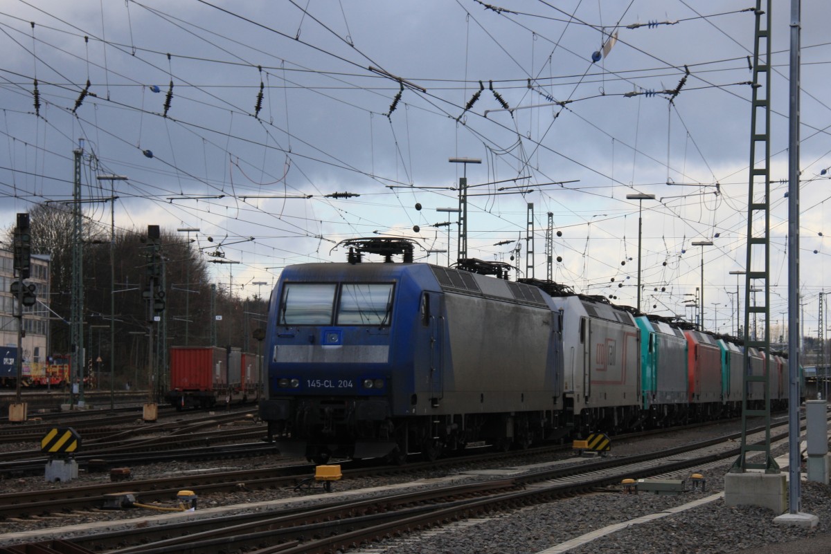 145 CL-204 von Crossrail steht mit 8 E-Loks von Crossrail stehen auf dem abstellgleis in Aachen-West bei Sonne und Regenwolken am 16.2.2014.