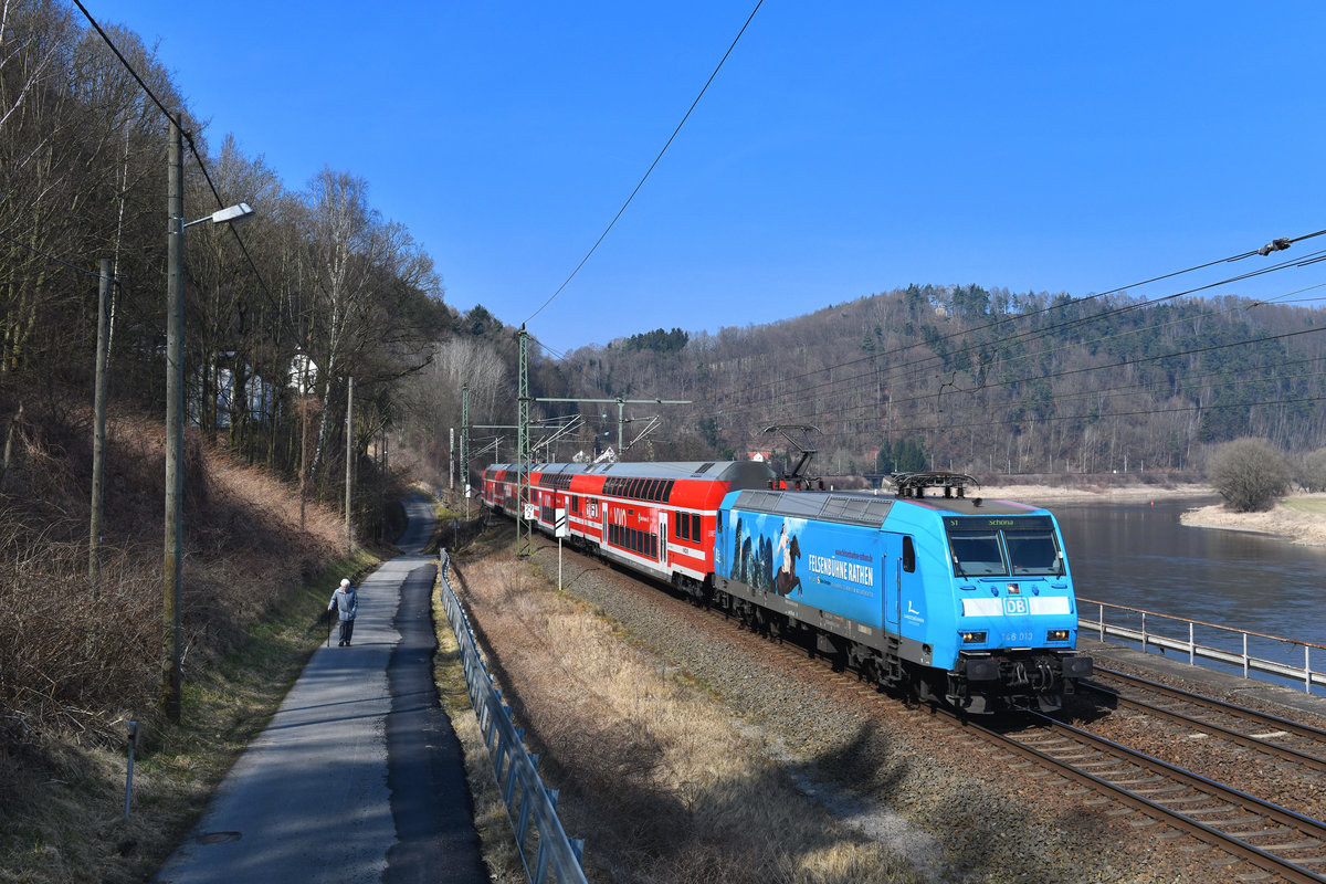146 013 mit einer S-Bahn am 25.03.2018 bei Königstein. 