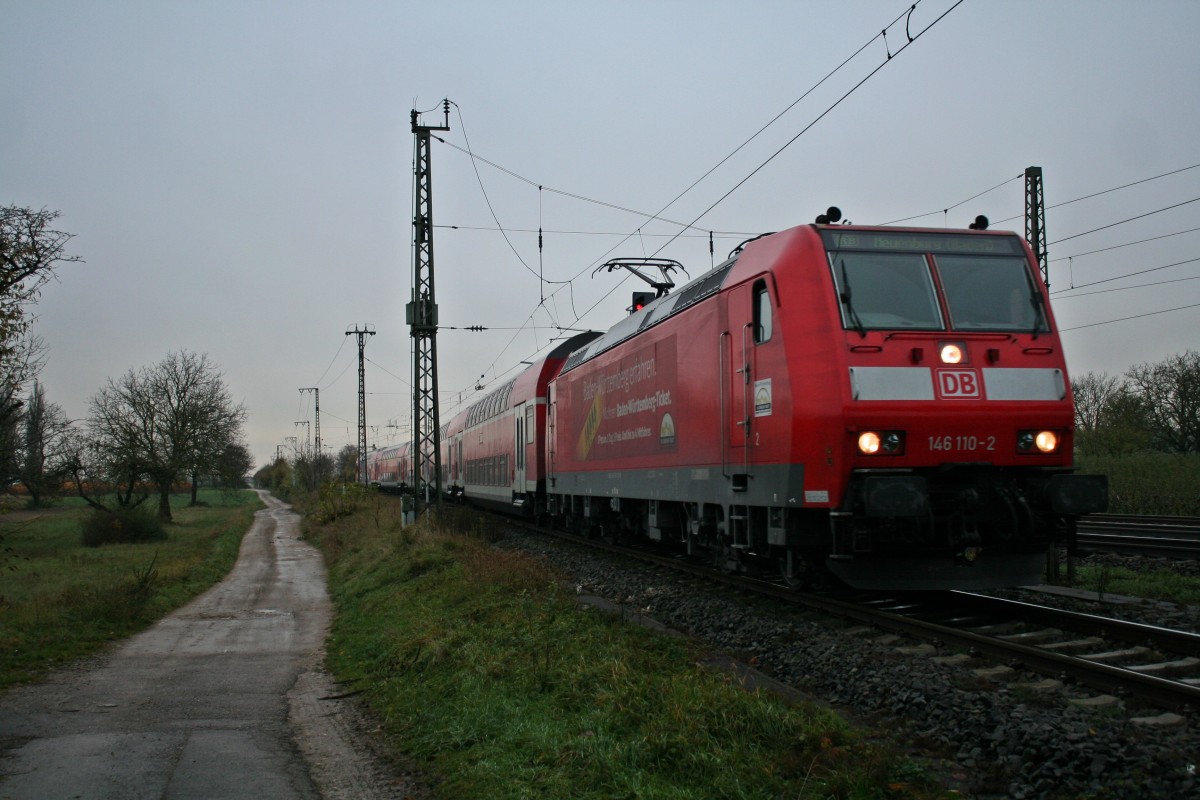 146 110-2 mit einer RB von Offenburg nach Neuenburg (Baden) am Nachmittag des 22.11.13 bei der Einfahrt ber Gleis 13 in Mllheim (Baden).