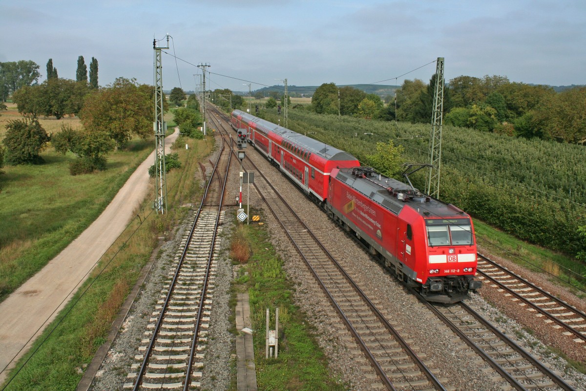 146 112-8 mit einem RE von Basel nach Offenburg am Nachmittag des 28.09.13 im nrdlichen Weichenbereich des Bahnhofs Mllheim (Baden).