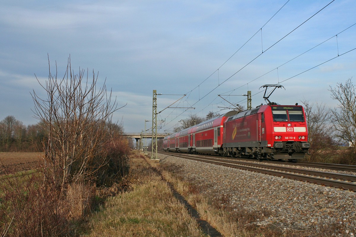 146 113-6 mit einem RE von Basel ber Freiburg (im Breisgau) Hbf nach Offenburg am Nachmittag des 18.01.14 sdlich von Buggingen Hbf.