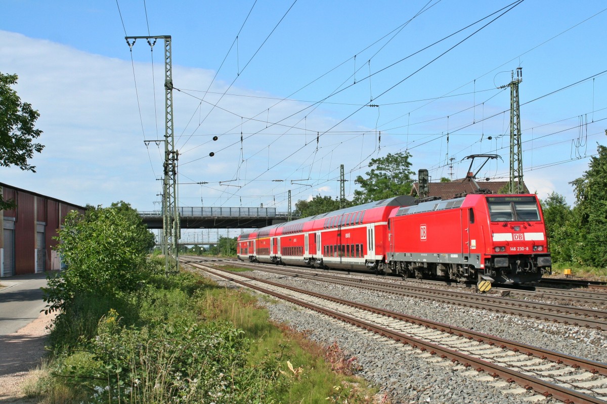 146 230-8 mit einem RE von Basel Bad. Bf nach Offenburg am Nachmittag des 14.06.14 beim Verlassen des Bahnhofs Mllheim (Baden).