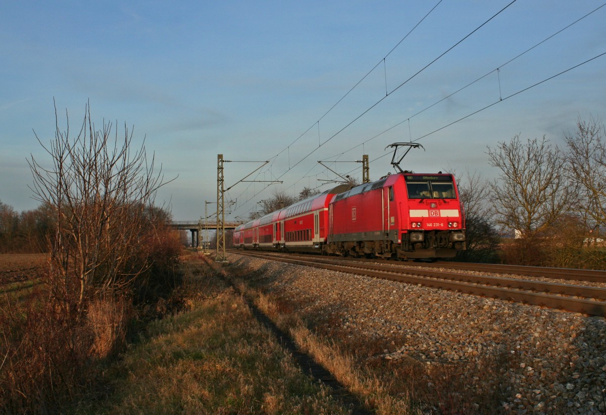 146 231-6 mit einem RE von Basel nach Offenburg am Abend des 18.01.14 sdlich von Buggingen.