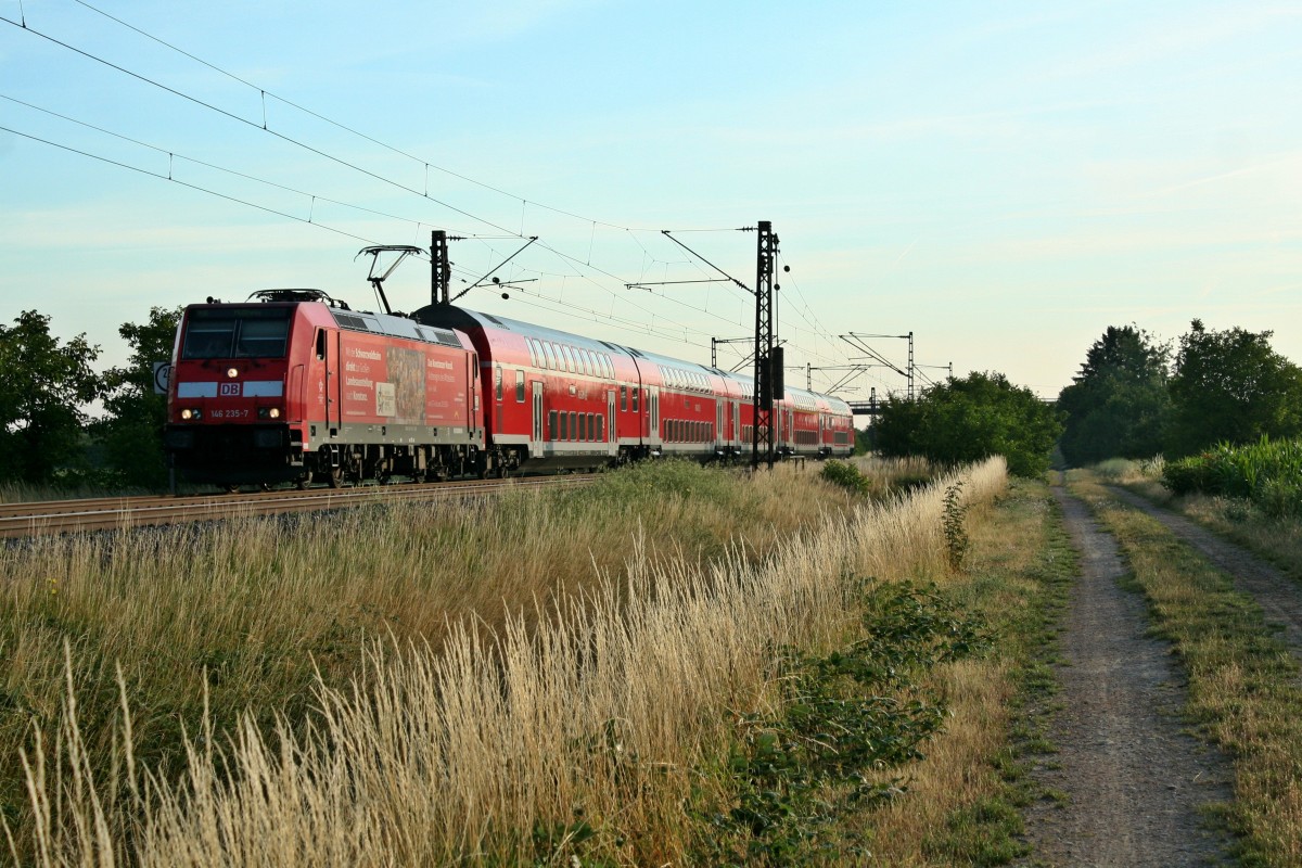 146 235-7 mit einer RB von Offenburg nach Mllheim (Baden) am Morgen des 03.07.14 westlich von Hgelheim.