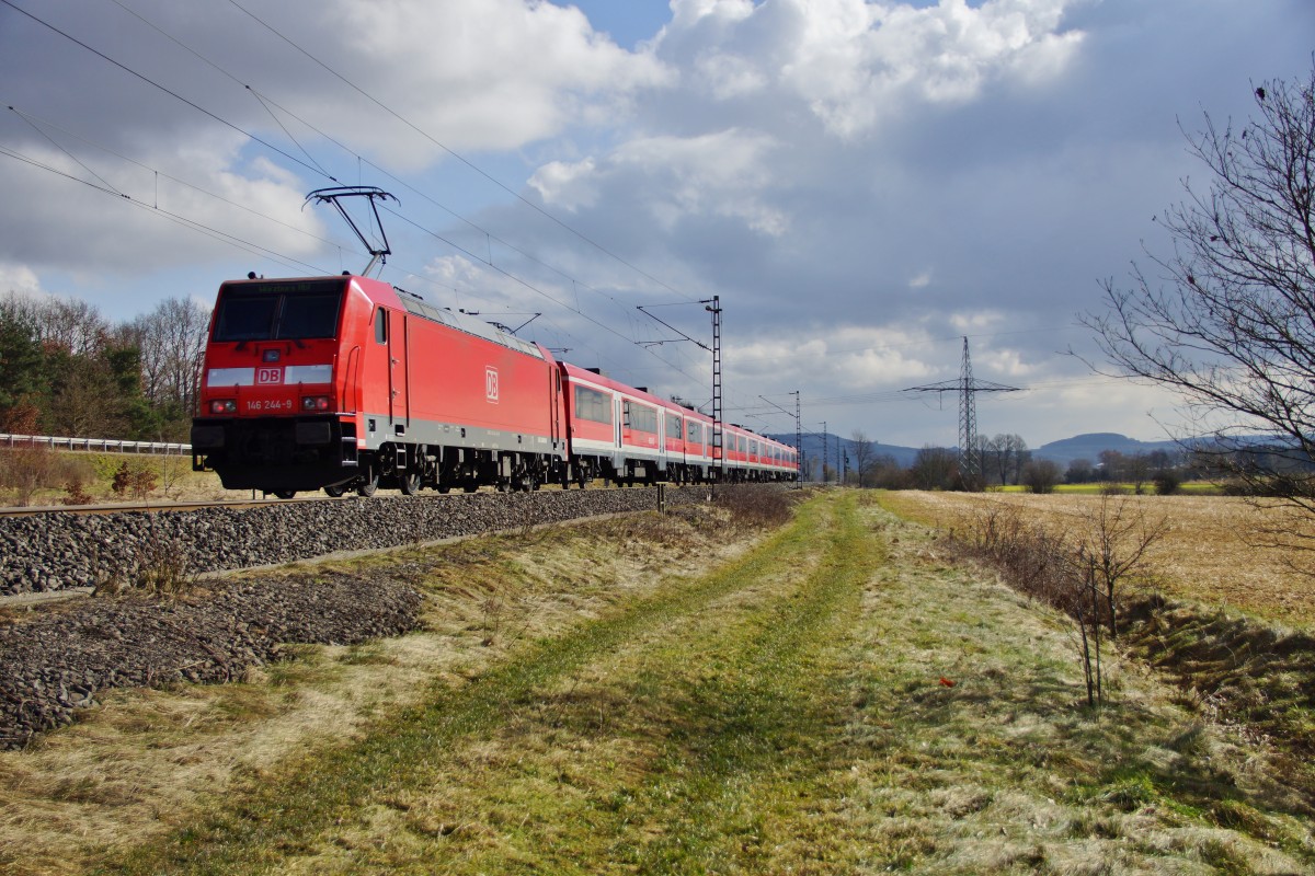 146 244-9 schiebt den RE nach Würzburg am 25.02.15 bei Harrbach.