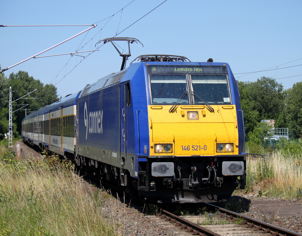 146 521-0 mit InterConnex 68904 von Warnemnde nach Leipzig Hbf vor dem nchsten fahrplanmigen Halt im Haltepunkt Rostock-Ltten Klein.04.07.2014