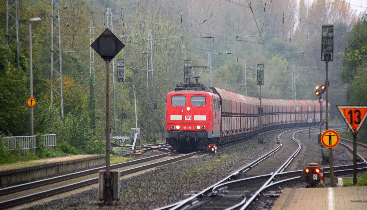 151 035-3 DB  kommt durch Kohlscheid aus Richtung Aachen-West mit eienem langen Kalkzug aus Yves-Gomezée(B) nach Millingen und fährt Richtung Herzogenrath,Neuss. 
Bei Regenwolken am Morgen vom 29.10.2014.