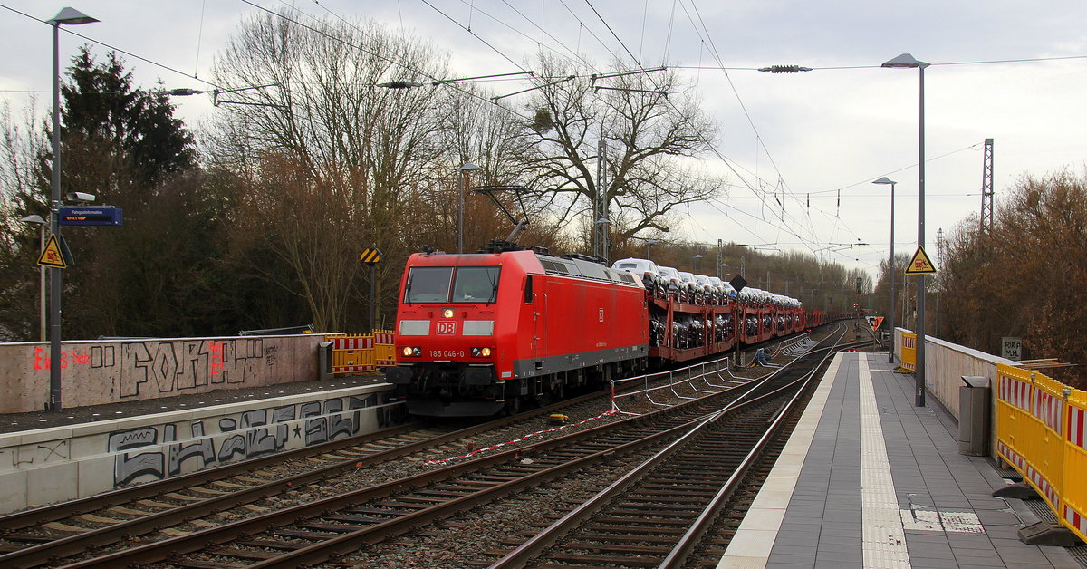 185 046-0 DB kommt als Umleiter aus Richtung Aachen-West mit einem Güterzug aus Muizen(B) nach Köln-Gremberg(D) und fährt durch Kohlscheid und fährt in Richtung Herzogenrath,Wickrath. 
Aufgenommen von Bahnsteig 2 in Kohlscheid.
Bei Sonne und Regenwolken am Vormittag vom 6.3.2019.