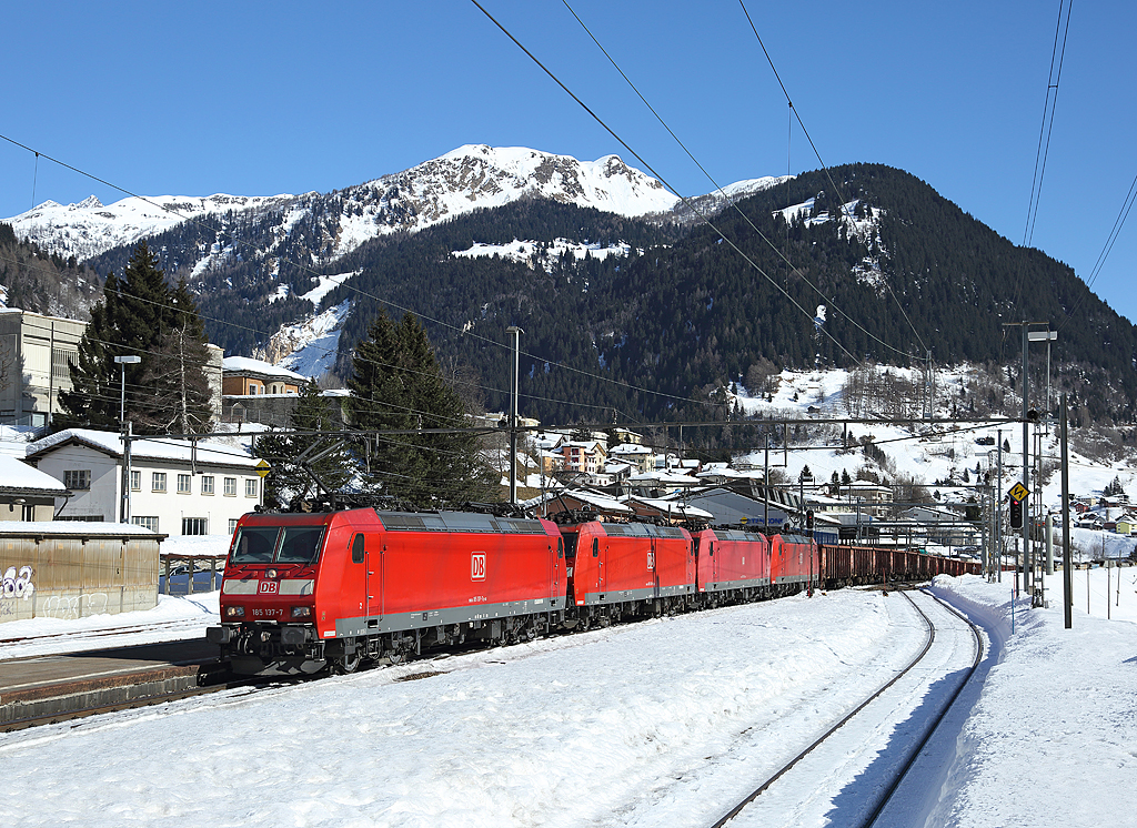 185 137 (and three other DB class 185`s) hauls a northbound cargo train through Airolo, 20 Feb 2015