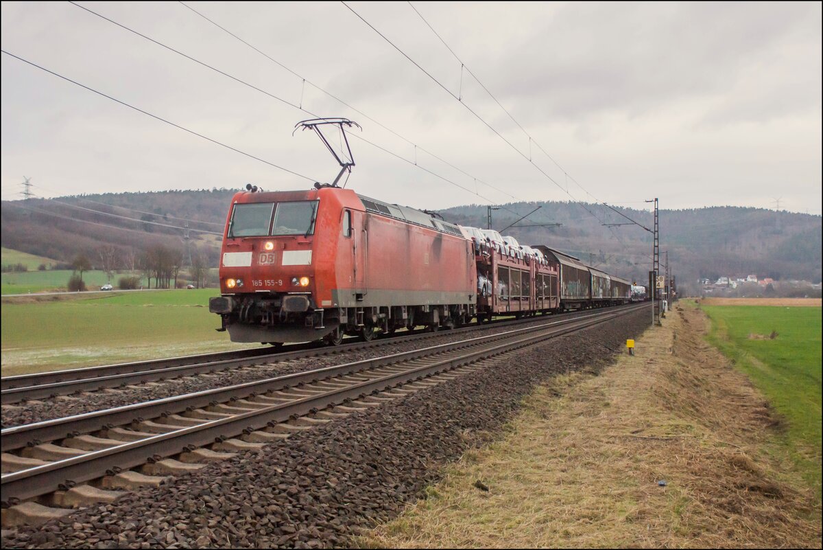 185 155-9 mit einem Mischer am 21.02.2024 bei Reilos.