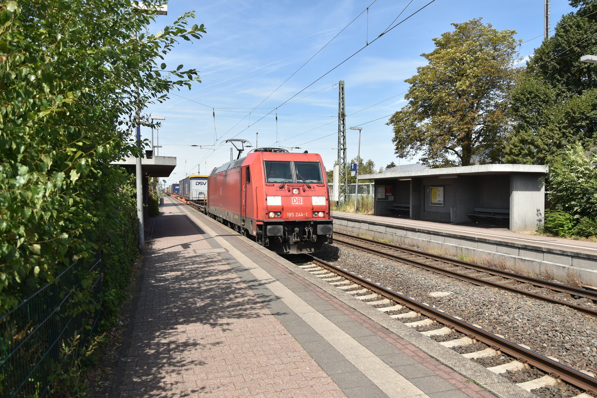 185 244-1 mit einem Klv in Richtung Köln durch Nievenheim fahrend am 12.8.2018
