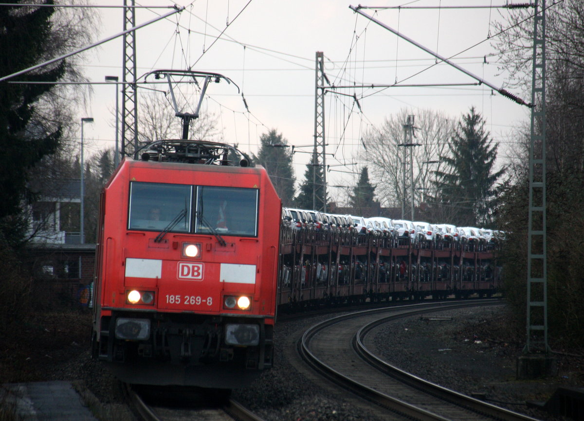 185 269-8 DB  kommt mit einem Audi-VW-Skoda-Zug aus Osnabrück nach Kortenberg-Goederen(B) und kommt aus Richtung Mönchengladbach-Hbf,Rheydt-Hbf,Wickrath,Beckrath,Herrath und fährt durch Erkelenz in Richtung Baal,Hückelhoven-Baal,Brachelen,Lindern,Süggerrath,Geilenkirchen,Frelenberg,Zweibrüggen,Übach-Palenberg,Rimburg,Finkenrath,Hofstadt,Herzogenrath, Kohlscheid,Richterich,Laurensberg,Aachen-West. 
Aufgenommen vom Bahnsteig 1 in Erkelenz. 
Bei Sonne und Wolken am Nachmittag vom 6.3.2017.
