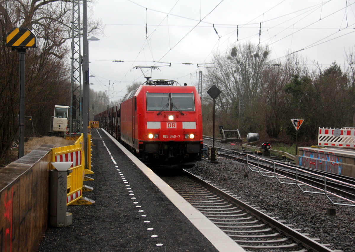 185 340-7 DB kommt durch Kohlscheid aus Richtung Aachen-West mit einem Autoleerzug aus Belgien nach Gelsenkirchen-Bismarck und fährt durch Kohlscheid und fährt in Richtung Herzogenrath. 
Aufgenommen vom Bahnsteig 1 in Kohlscheid. 
Bei Regenwetter am Nachmittag vom 15.3.2019.