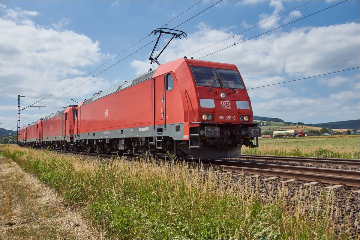 185 391-0 als Lokzug mit der 185 319-1+185 270-6+185 349-8 ist am 20.06.2018 bei Reilos zu sehen.