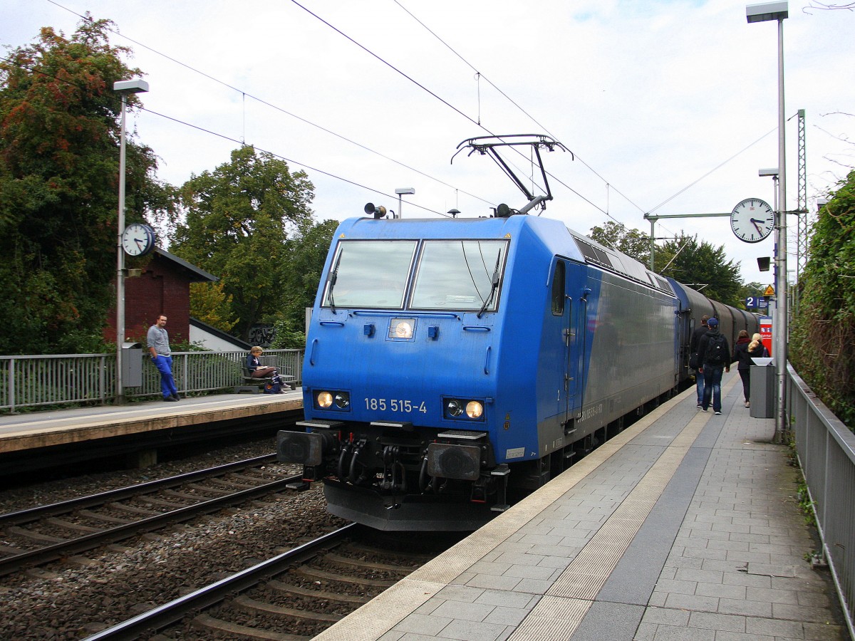 185 515-4 von Railtraxx  kommt aus Richtung Aachen-West auf dem falschen Gleis mit einem langen Coilzug aus Antwerpen-Waaslandhaven(B) nach Linz-Voestalpine(A) und fährt durch Aachen-Schanz in Richtung Aachen-Hbf,Aachen-Rothe-Erde,Stolberg-Hbf(Rheinland)Eschweiler-Hbf,Langerwehe,Düren,Merzenich,Buir,Horrem,Kerpen-Köln-Ehrenfeld,Köln-West,Köln-Süd. 
Bei Regenwetter am Nachmittag vom 22.9.2015.