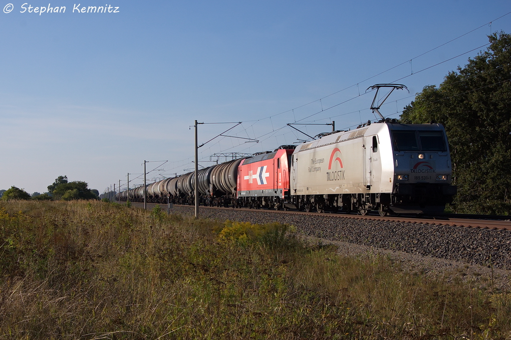 185 531-1  Renate  TXL - TX Logistik AG mit der Wagenlok 185 603-5 [HGK 2063] und einem Kesselzug  Benzin oder Ottokraftstoffe  in Vietznitz und fuhr in Richtung Nauen weiter. Die 185 531-1 scheint momentan f�r die RheinCargo zu fahren. 05.09.2013