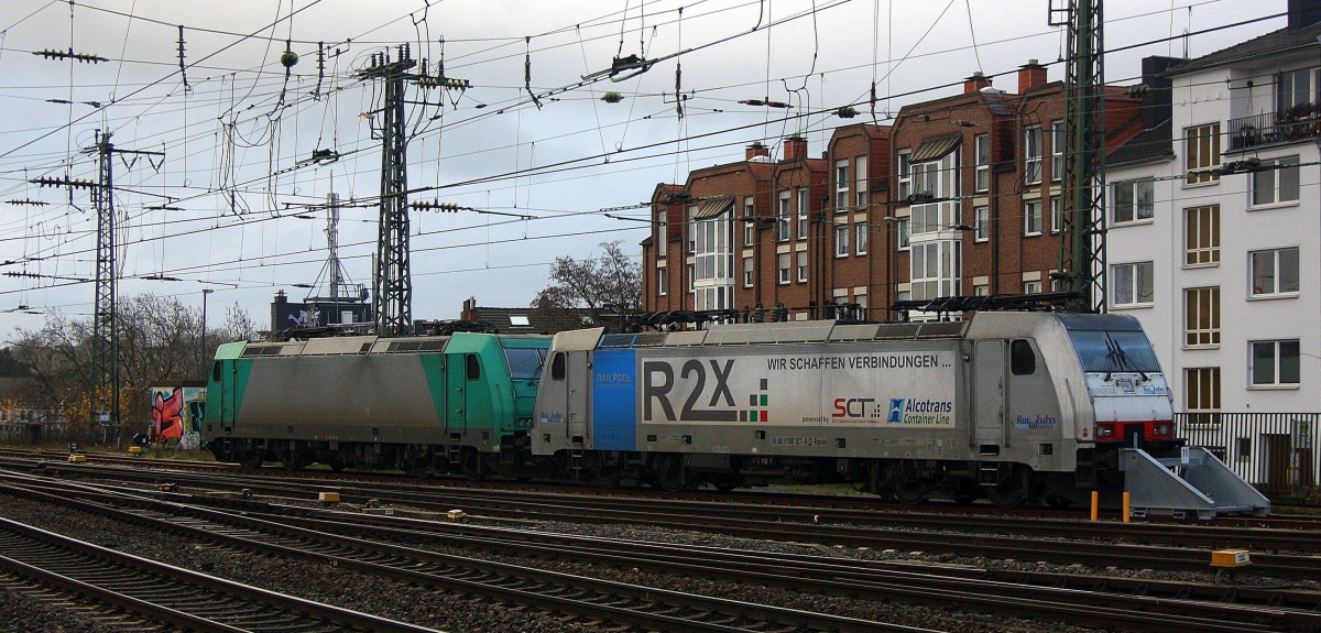 186 107 von der Rurtalbahn und 185er von LTE stehen im Aachener-HBF abgestellt bei Regenwolken am Nachtmittag vom 25.12.2014.