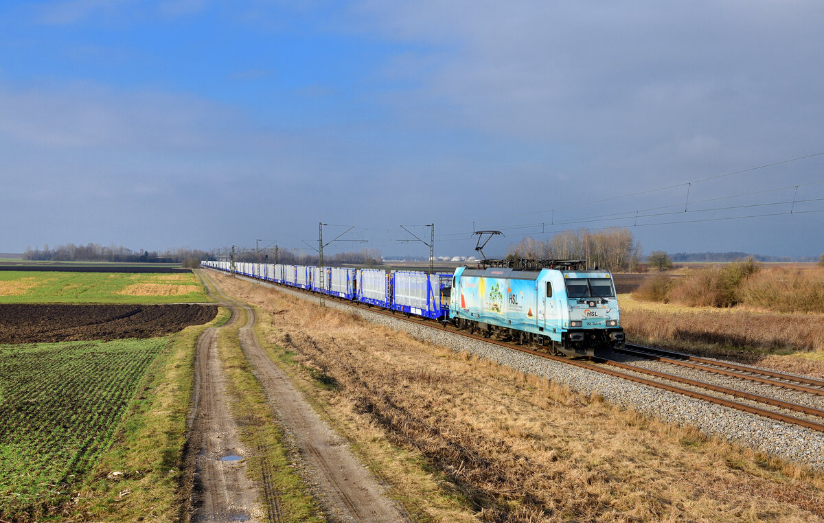 186 364 mit einem leeren Autozug am 19.01.2022 bei Osterhofen.
