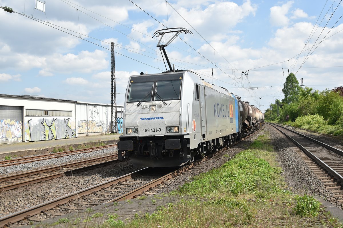 186 431-3 kommt mit Kesselwagen gen Sechtem durch Roisdorf. 1. Mai 2018