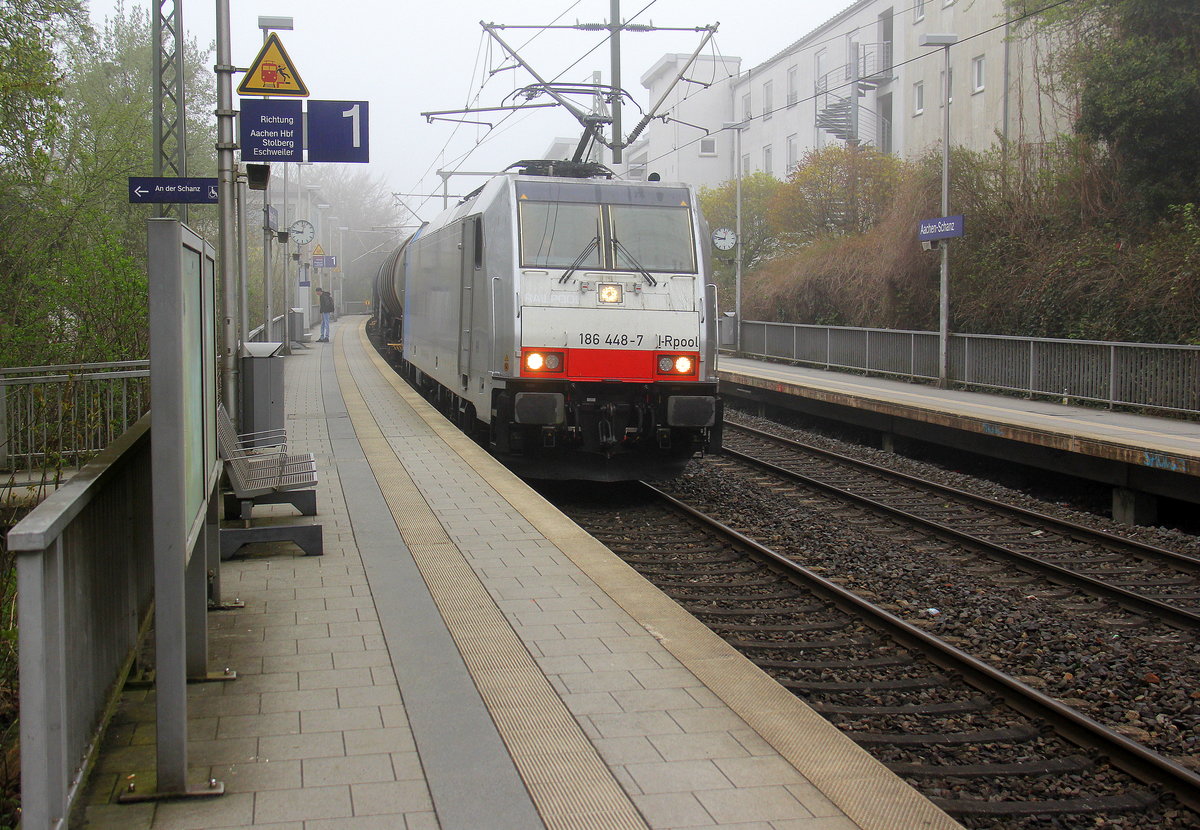 186 448-7 von Railpool kommt durch Aachen-Schanz mit einem Kesselzug aus Antwerpen-BASF(B) nach Ludwigshafen-BASF(D) und kommt aus Richtung Aachen-West und fährt in Richtung Aachen-Hbf,Aachen-Rothe-Erde,Stolberg-Hbf(Rheinland)Eschweiler-Hbf,Langerwehe,Düren,Merzenich,Buir,Horrem,Kerpen-Köln-Ehrenfeld,Köln-West,Köln-Süd. 
Aufgenommen vom Bahnsteig von Aachen-Schanz.
Am Morgen vom 12.4.2018. 