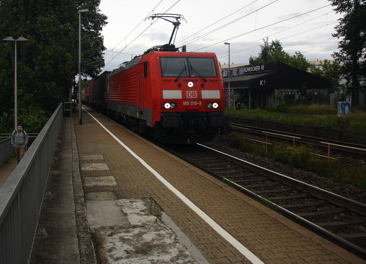 189 016-9 DB  kommt durch Kohlscheid mit einem langen Containerzug aus Gadki(PL) nach Antwerpen-BASF(B) und fährt die Kohlscheider-Rampe hoch nach Aachen-West und fährt in Richtung Richterich,Laurensberg,Aachen-West.
Bei Sonne und Regenwolken am Morgen vom 17.9.2015.