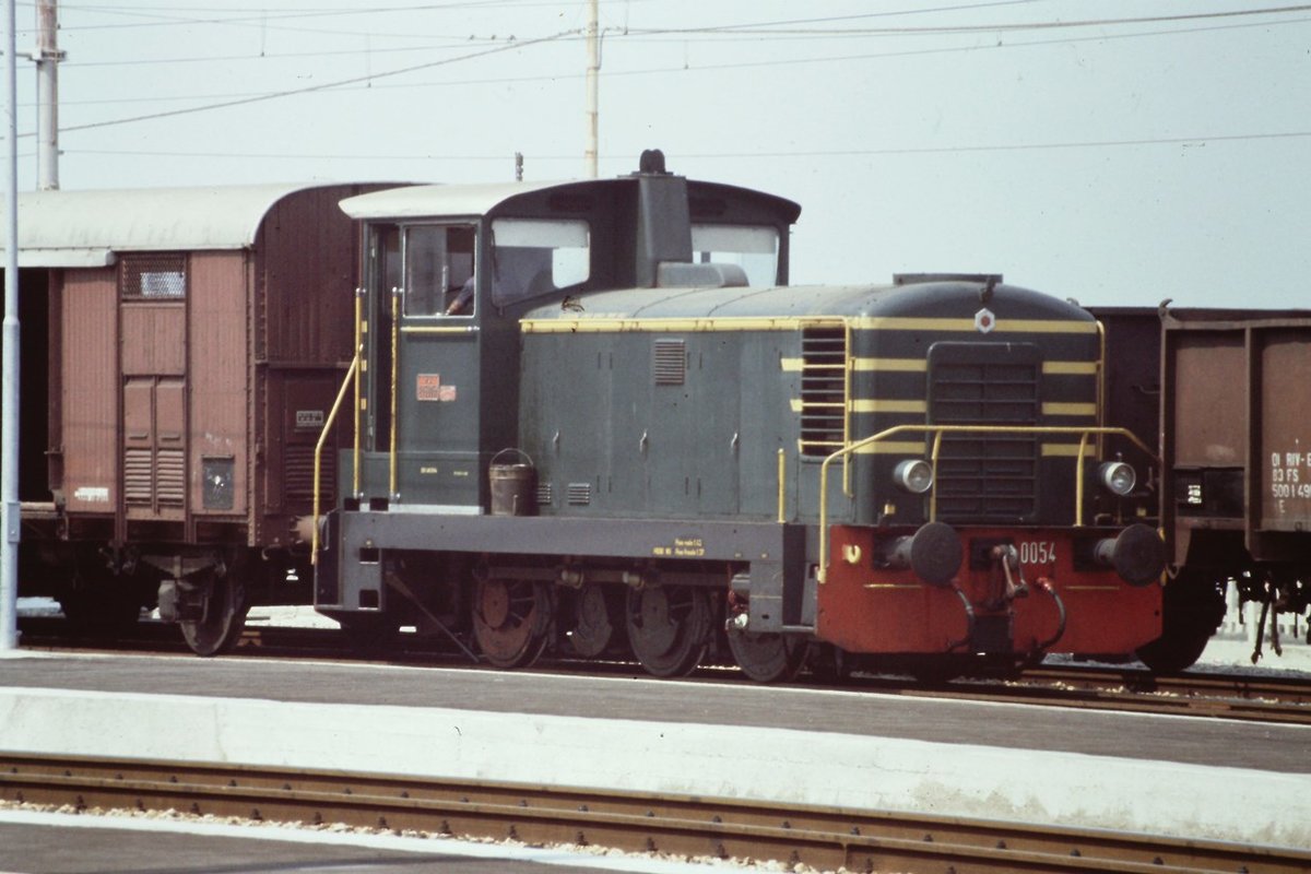 1984. diesel 245.0054 maneuvering at Falconara Marittima station some freight wagons.
