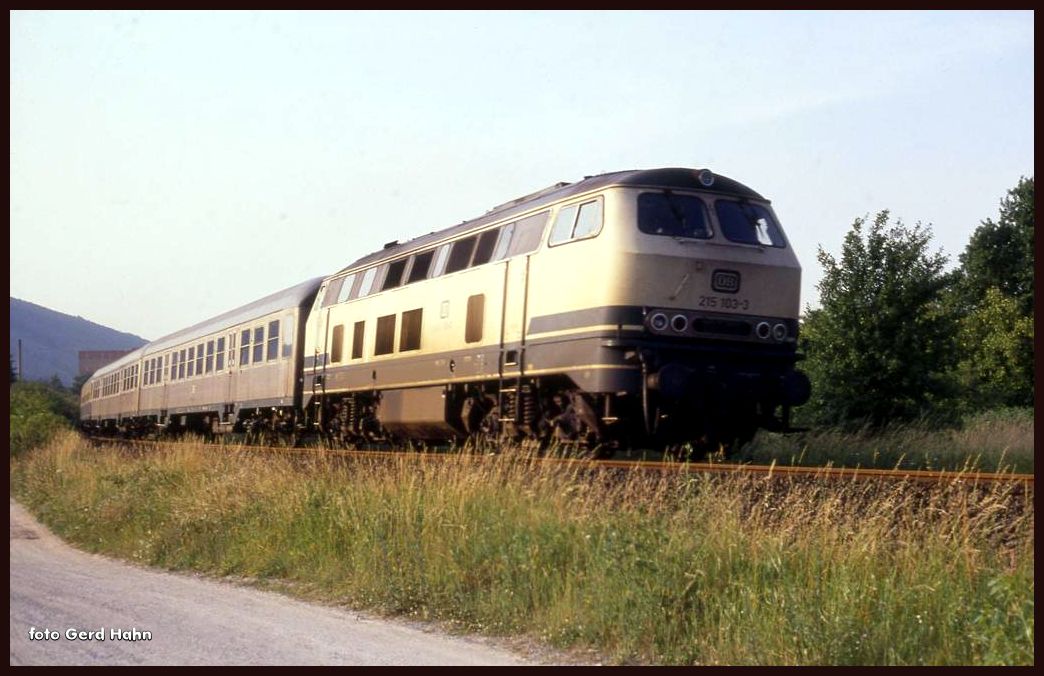 215103 mit E 3125 am 4.7.1991 um 7.28 Uhr bei Wörth auf dem Weg nach Aschaffenburg.