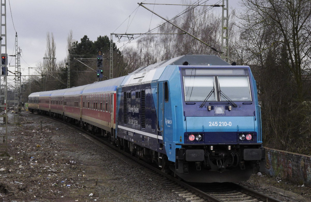 245 210 schiebt einen RE 6 Westerland - Hamburg-Altona aus dem Bf. Elmshorn, 21.3.18.