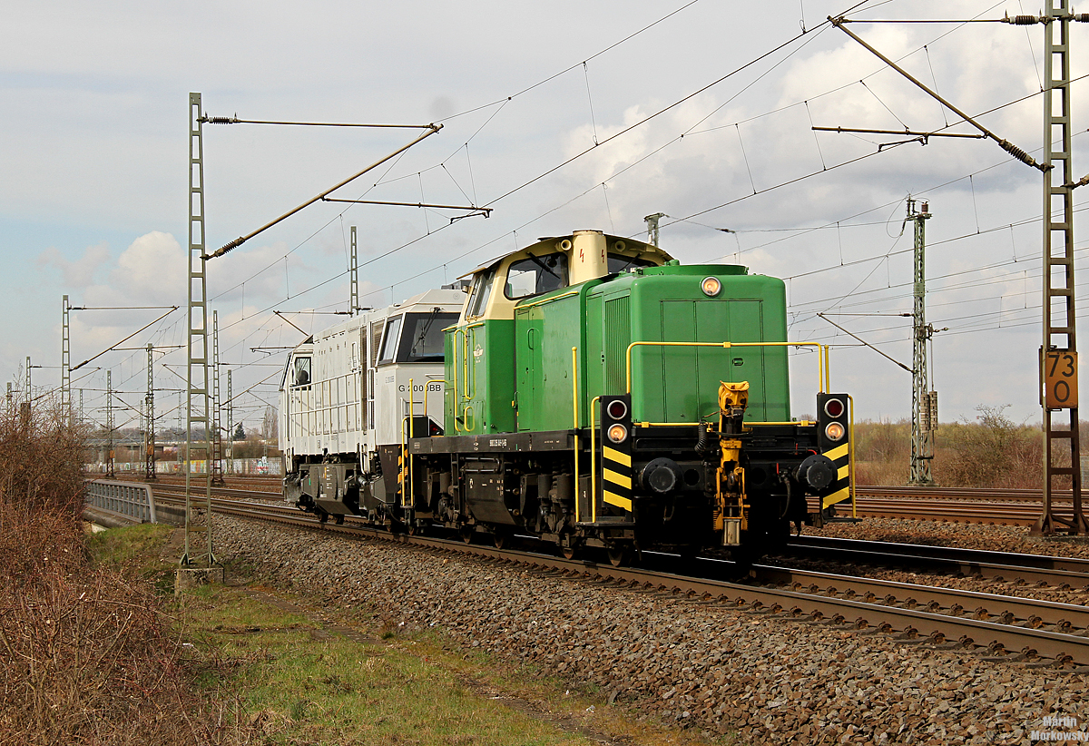 295 049 mit einer G2000 im Schlepp bei Porz(Rhein) am 26.03.2018