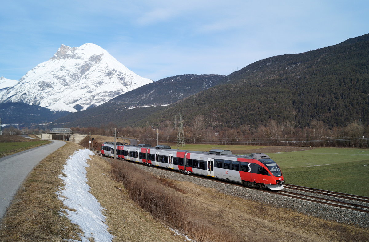 4024 068 als S 1 (Telfs-Pfaffenhofen - Kufstein) vor der Hohen Munde bei Flaurling, 19.01.2019.