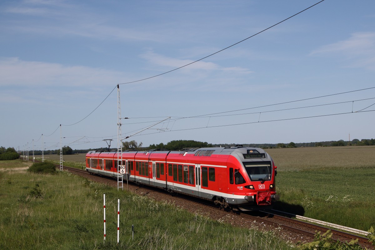 429 030 als RE 9 nach Rostock Hbf in Mönchhagen. Fotografiert am 05.06.2015.