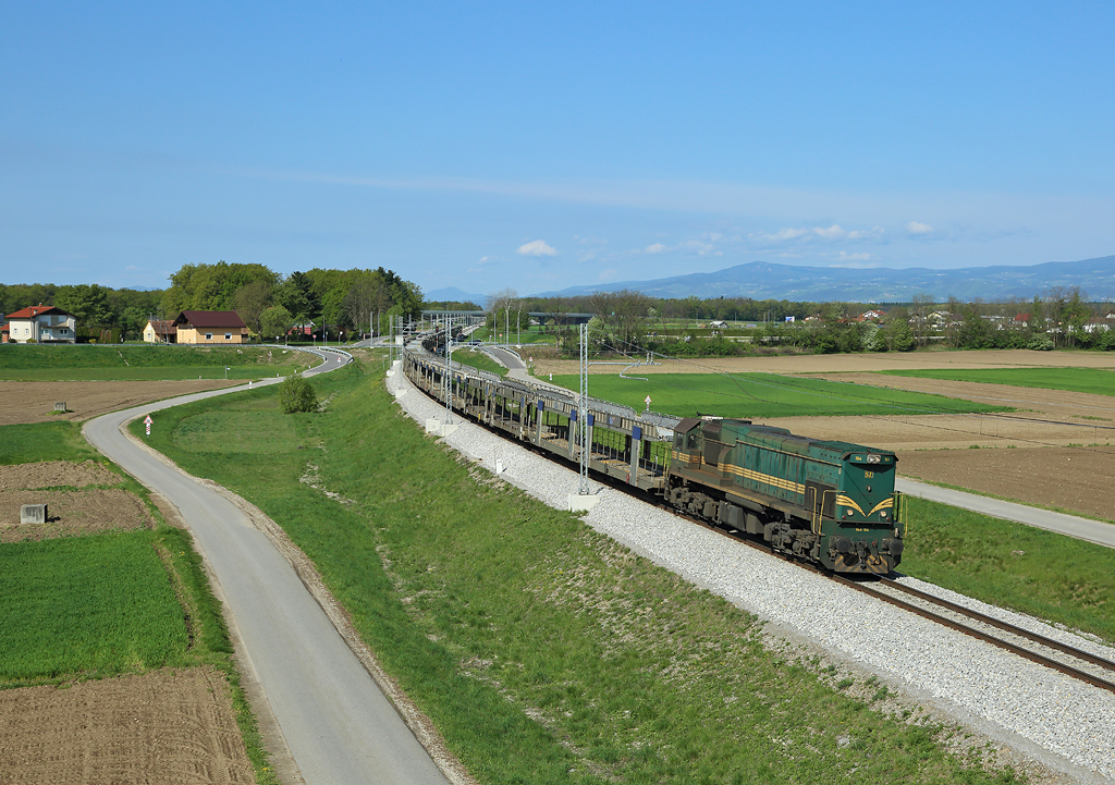 664 104  approaches Ptuj whilst working an empty car train from Pragersko to Hodoš,  15 April 2016