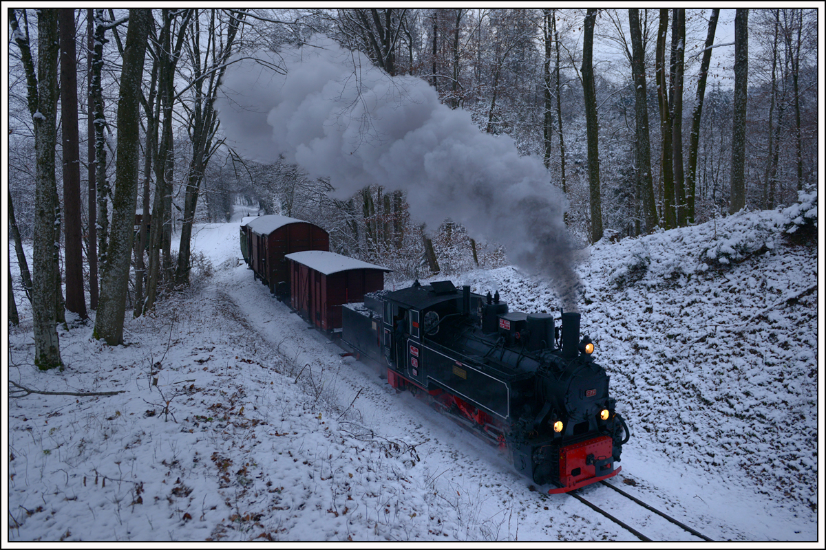 764-411R der Stainzer Bahn am 16.12.2018 mit einem Güterzug von Preding nach Stainz, aufgenommen kurz vor Kraubath.