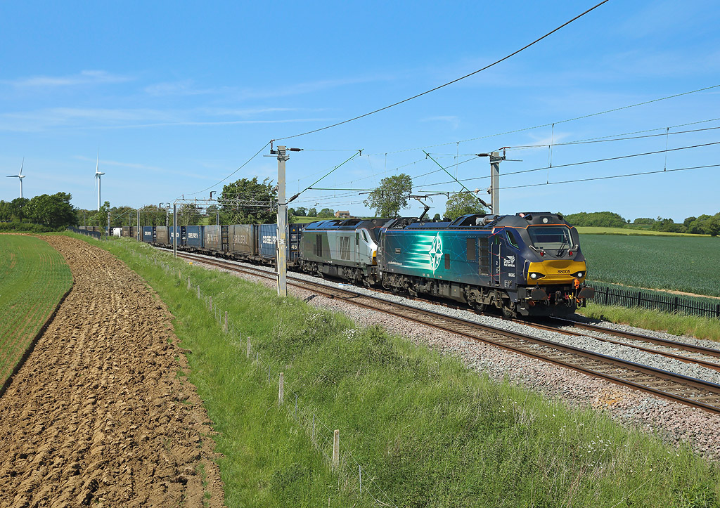 88005 & 68015 pass Watford Village whilst hauling the diverted 4Z45 Daventry to Mossend. Due to engineering work north of Crewe the train was diverted via London and the East Coast Main Line 25th May 2020