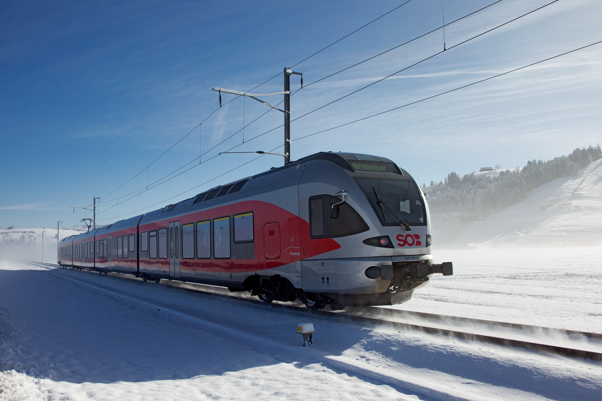 Als S 31 braust der SOB Triebzug RABe 526 047-6  Rossberg  von Arth Goldau nach Biberbrugg in Schwyzerbrugg vorüber.Bild vom 24.2.2016
