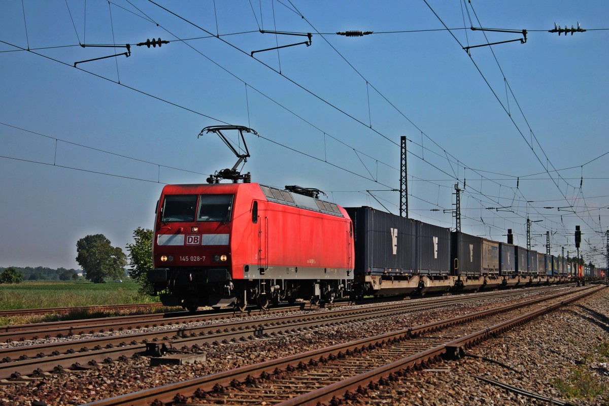 Am 07.06.2013 fuhr die Berliner 145 028-7 mit einem buntem Containerzug durch Orschweier gen Freiburg.