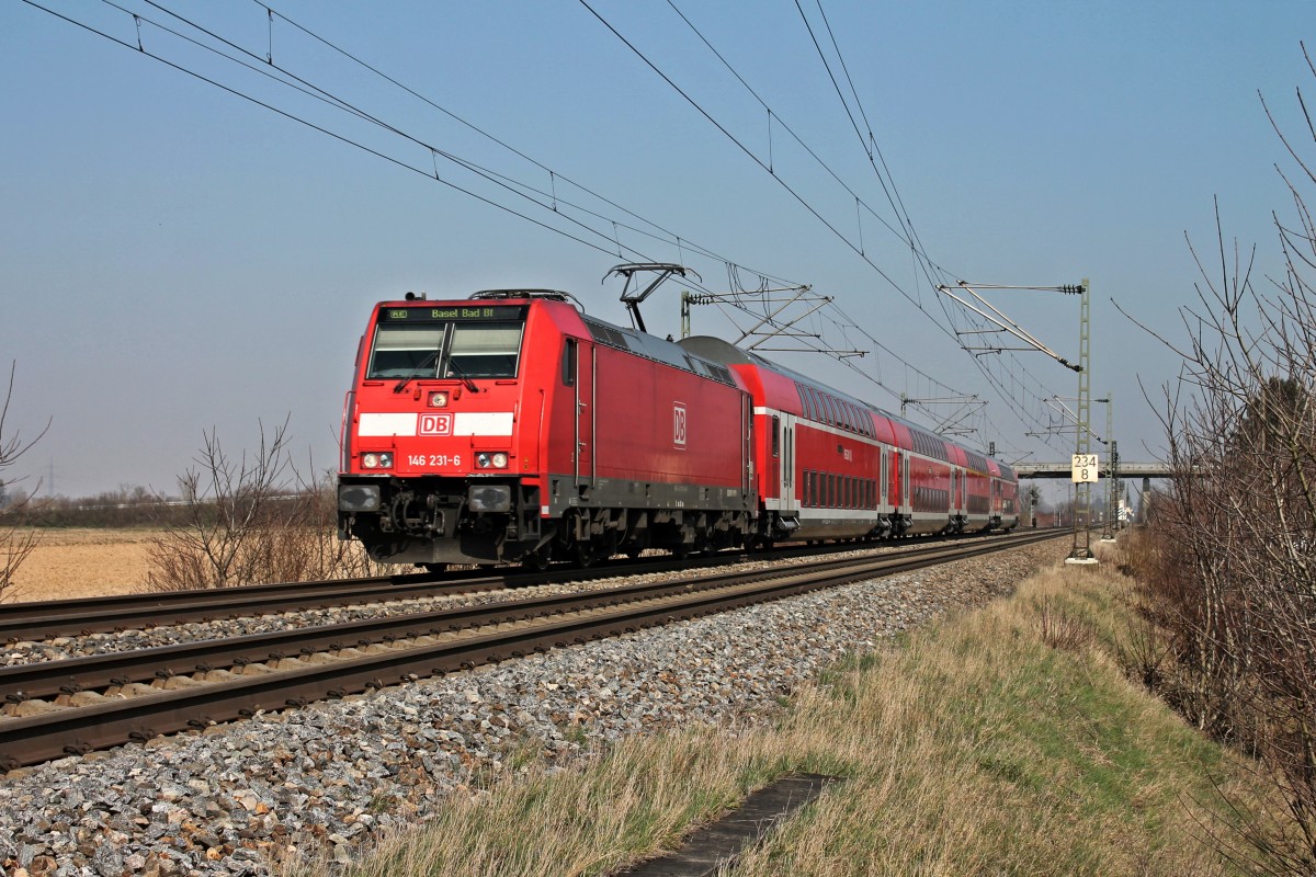 Am 08.03.2014 fuhr die Freiburger 146 231-6 als RE aus Offenburg nach Basel Bad Bf ihrem nächsten Zwischenhalt in Müllheim (Baden) entgegen.